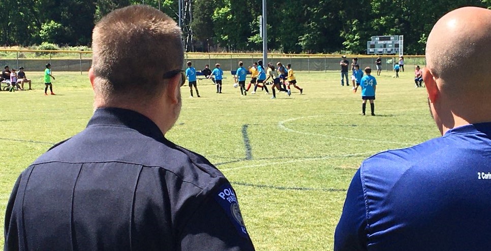 Pineville Police volunteers to coach soccer with Hope Soccer Ministries.