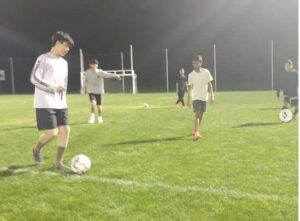 Coach Henry runs an efficient practice with his U13s. 